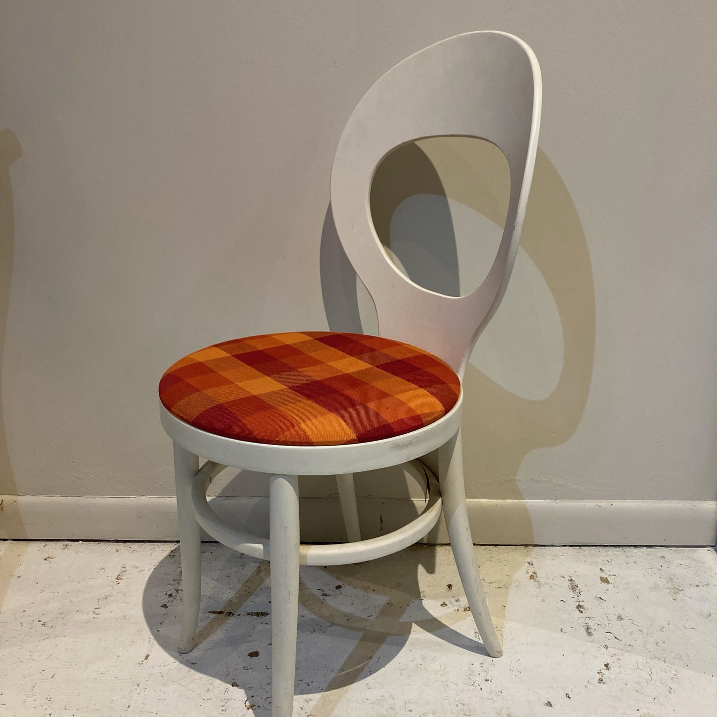 White Baumann Chair with Red/Orange Patterned Seat